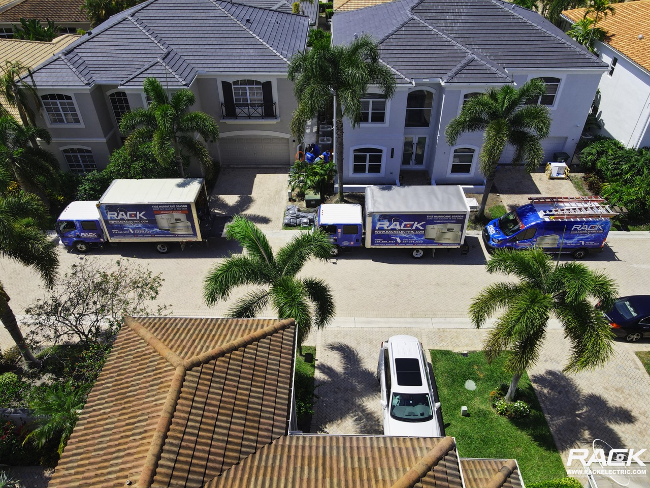 rack trucks in front of house